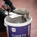 Repairing holes and cracks in cement/concrete floors