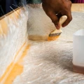 Covering an object with glass fabric and epoxy